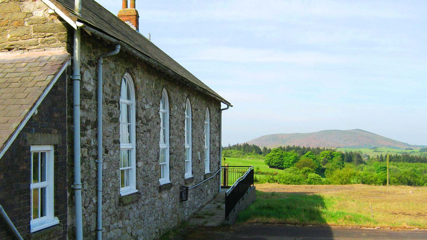 The Bog Centre in foreground with view over hills behind