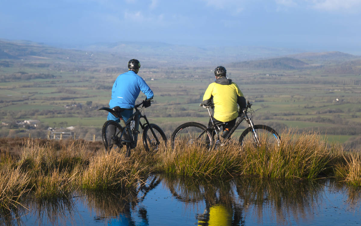 Two cyclists admiring the view of the Shropshire countryside
