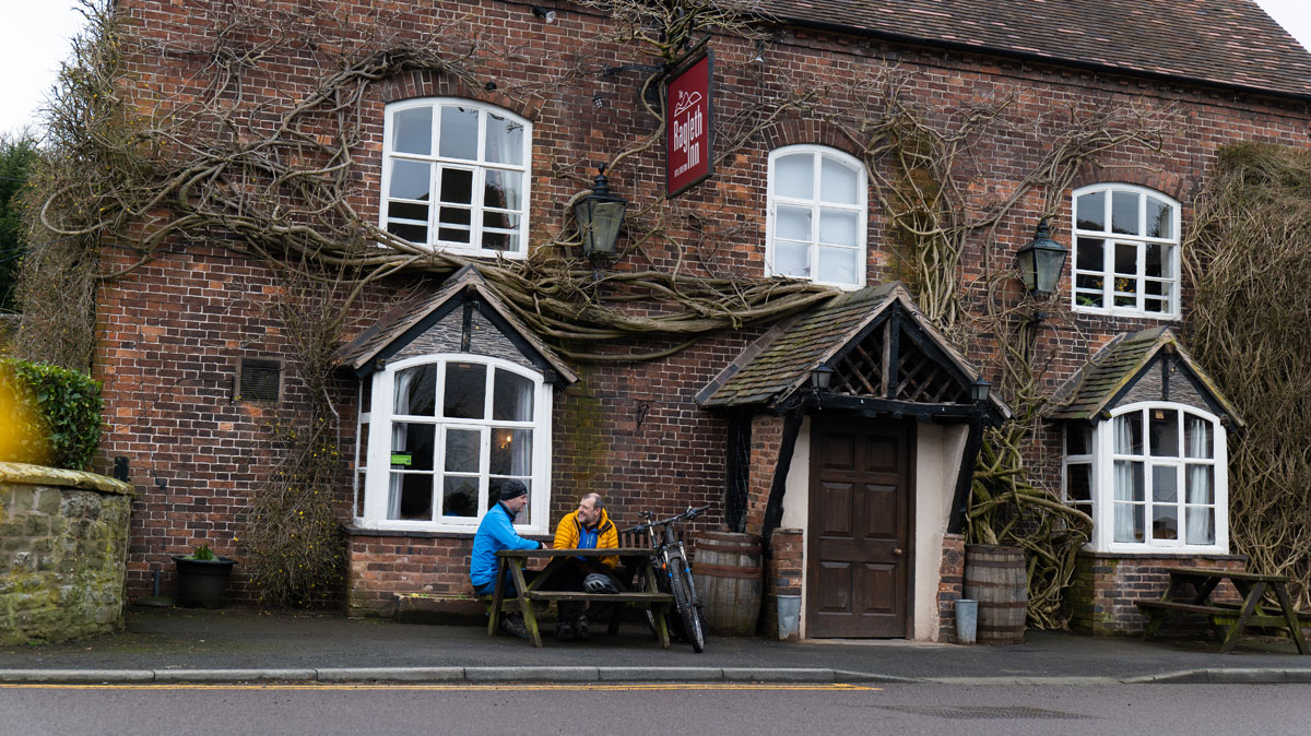 Two people enjoy a drink outside a Shropshire pub