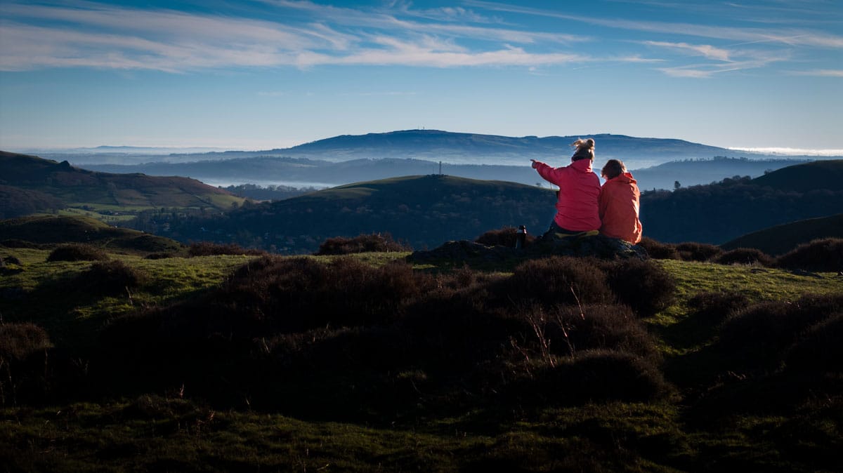 walkers admiring the view on the Longmynd near Church Stretton