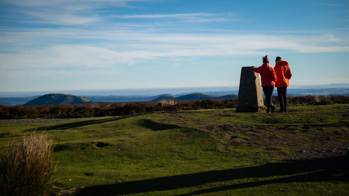 Walkers at  Trig Point Long Mynd