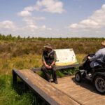 View of Whixall Moss at the Mamouth tower - lady in mobility scooter