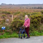 Man standing at the accessible parking NNR Stiperstones