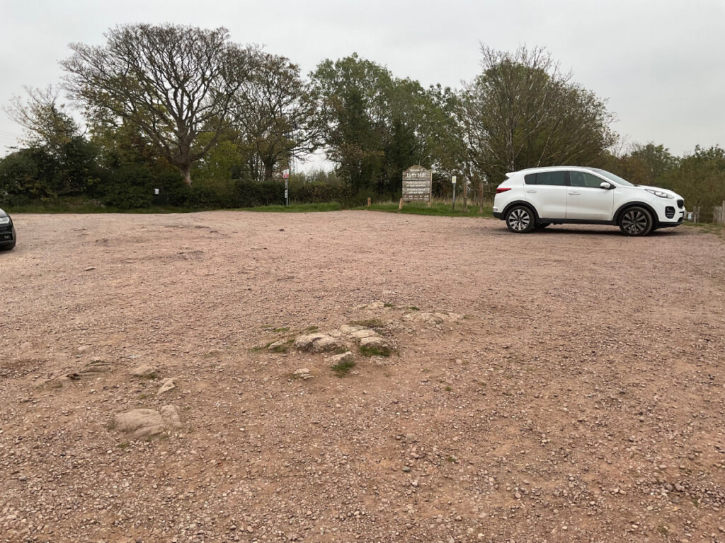 Photo showing a car at the Lyth Hill car park with some low level rocks which can provide a barrier.