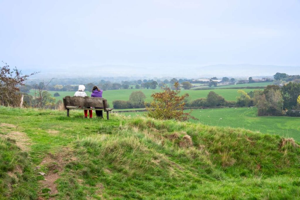 Photo of two ladies looking at the view from a bench at Castle Pulverbach.