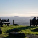 2 people sitting looking at the view