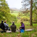 3 people sitting on a bench in Darnford valley