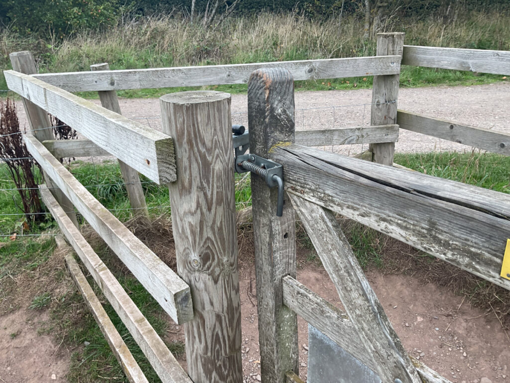 Photo showing a latched gate next to the toposcope at Lyth hill from the other side with a lift latch.