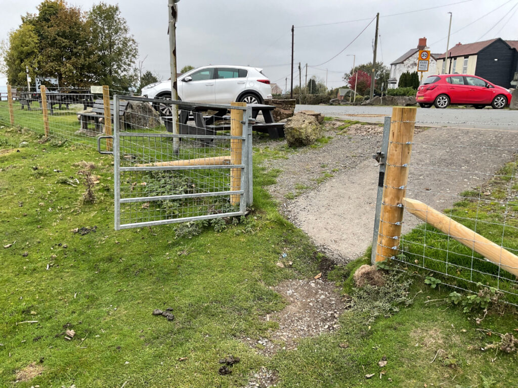 Photo showing a significant change in gradient from the car park to the field gate at Clee Hill.