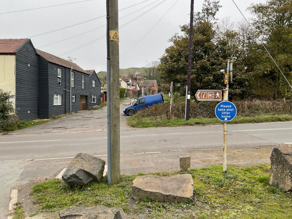 Photo of a finger post at clee hill indicating the direction to the WC facilities.
