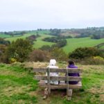 Two ladies looking at the view from a bench at Castle Pulverbach