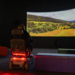 Watching a film in the Discovery Centre Craven Arms - mobility scooter