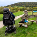 2 people at the Onny meadows trail - one on a mobility scooter