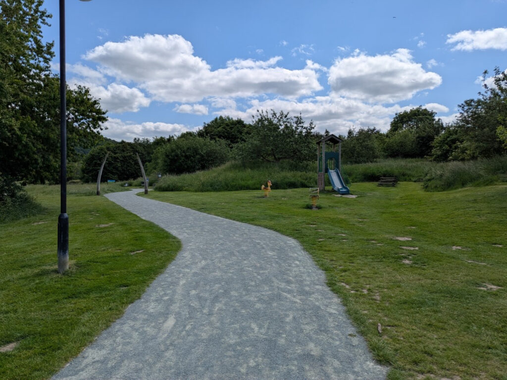 Picture of the Onny Meadows with an outdoor children's play area on the right side of the picture.